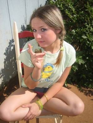 Cute teenage babe Shelby takes a smoke break and flashes us her perky tits - #main