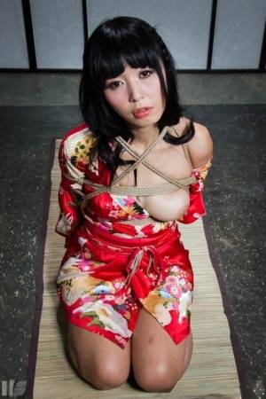 Beautiful Asian girl Marica Hase is suspended by ropes with red toenails on www.galphoto.com