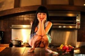 Japanese housewife Marica Hase releases her tits and twat from an apron - Japan on galphoto.com
