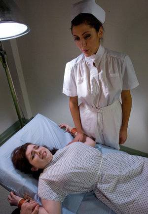 Restrained female is tortured and masturbated by a kinky woman on www.galphoto.com