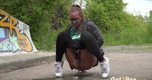 Naomi Bennet squats to pee and wipes afterwards on galphoto.com
