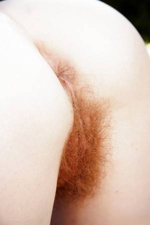 Redheaded and freckled mom Ana Molly flashing hairy pussy outdoors on galphoto.com