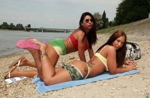 Lesbian babes Kyra Hot and Candy Coxx are having amazing time outdoor on galphoto.com