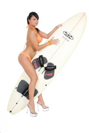Sexy surfer girl Sarah peels off her bikini to model naked on her board on galphoto.com