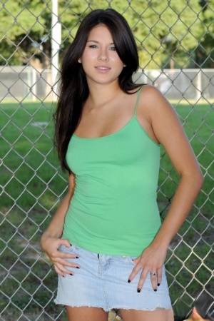 Sexy ten Shyla Jennings exposes her firm tits and bald twat at a ballpark on www.galphoto.com