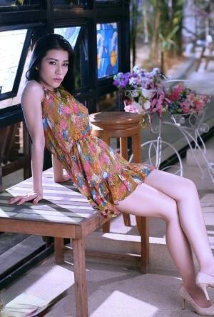 Thai beauty Mei Mei gets naked on top of a table near windows - Thailand on galphoto.com