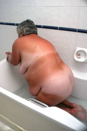 Obese old woman Grandma Libby gets completely naked while having a bath on galphoto.com