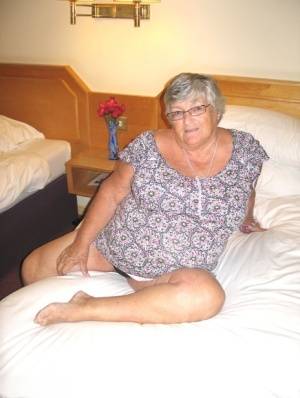 Silver haired British woman Grandma Libby exposes her fat body on a bed - Britain on galphoto.com