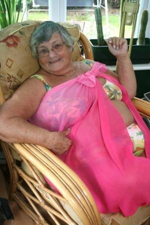 Horny old granny in glasses disrobes to reveal huge saggy tits & big BBW ass on galphoto.com