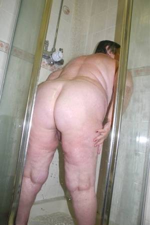 Obese granny Grandma Libby fondles her naked body while taking a shower on galphoto.com