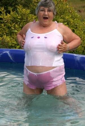 Overweight UK nan Grandma Libby exposes her boobs in a backyard swimming pool - Britain on galphoto.com
