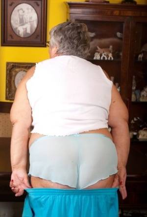 Obese UK lady Grandma Libby completely disrobes on a dining chair - Britain on galphoto.com