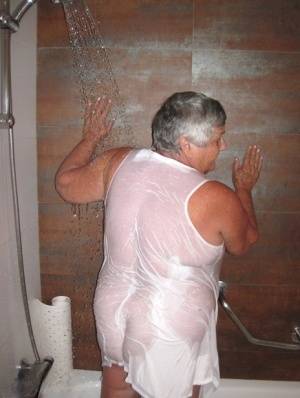 Obese amateur Grandma Libby blow drys her hair after taking a shower on galphoto.com