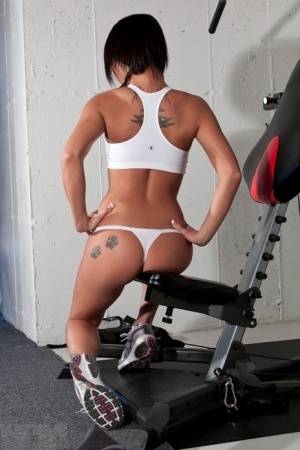 Hot sexy Nikki Sims whale tailing topless at the gym in white thong panties on galphoto.com