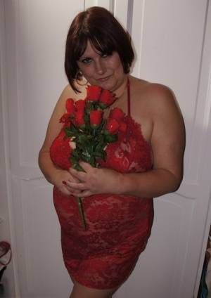 Busty mature lady holds roses while being joined by topless girlfriends on galphoto.com