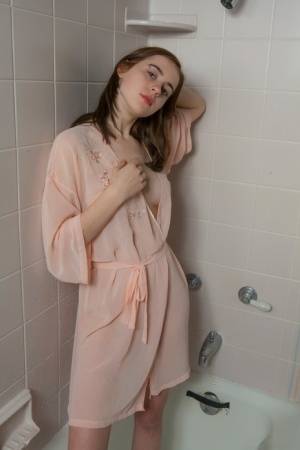 Cute young teen Eva Green petting her wet bald pussy in the shower on www.galphoto.com