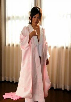 Japanese solo girl slips off her robe to reveal her nice boobs in white socks - Japan on www.galphoto.com