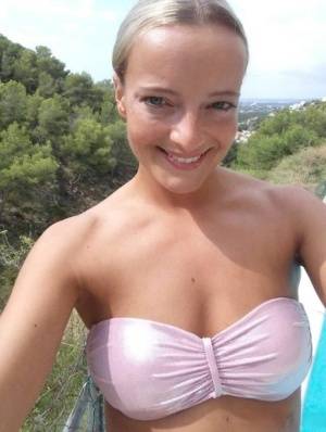 Blonde amateur Victoria takes a series of nude and non nude selfies on galphoto.com