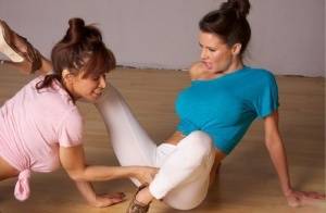 Clothed females Devon Michaels & Veronica Avluv grab crotches in yoga pants on galphoto.com