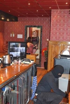 Amateur chick Kimberly Scott and a girlfriend disrobe a hooded male robber on www.galphoto.com