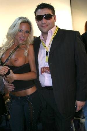 Blonde MILF Silvia Saint fully clothed posing & flaunting big tits at party on www.galphoto.com