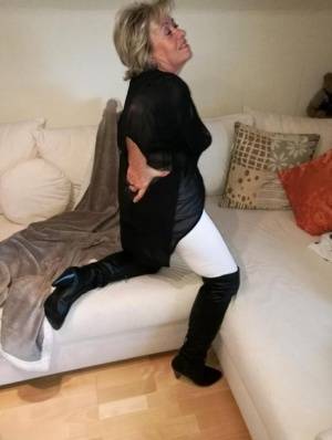 Amateur fatty Caro removes OTK boots and white hose to show her snatch on galphoto.com