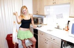 Fuckable blonde amateur Roxy Lovette slowly getting rid of her clothes on galphoto.com