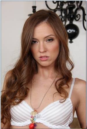 Pretty babe Maddy O'Reilly stripping and exposing her shaved slit on galphoto.com