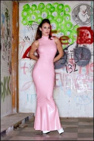 Latina beauty Ryan Keely inserts a vibrator after removing a long latex dress on galphoto.com