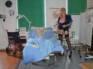 Blonde nurse Barby Slut exposes her boobs and pussy on a hospital bed