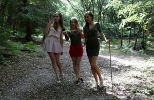 3 young girls walking in the woods find a restrained man and suck his cock